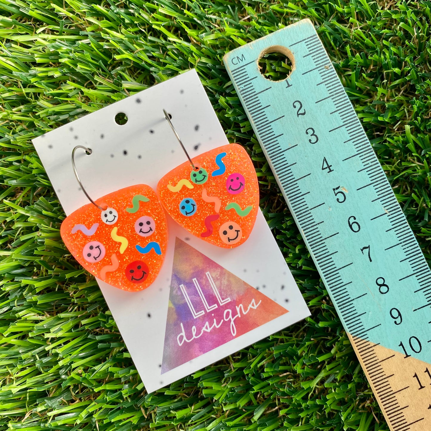ON SALE!!! Resin Earrings - Glitter Neon Orange Guitar Pick Hoops Featuring Hand Placed Rainbow Smiley Faces and Squiggles!