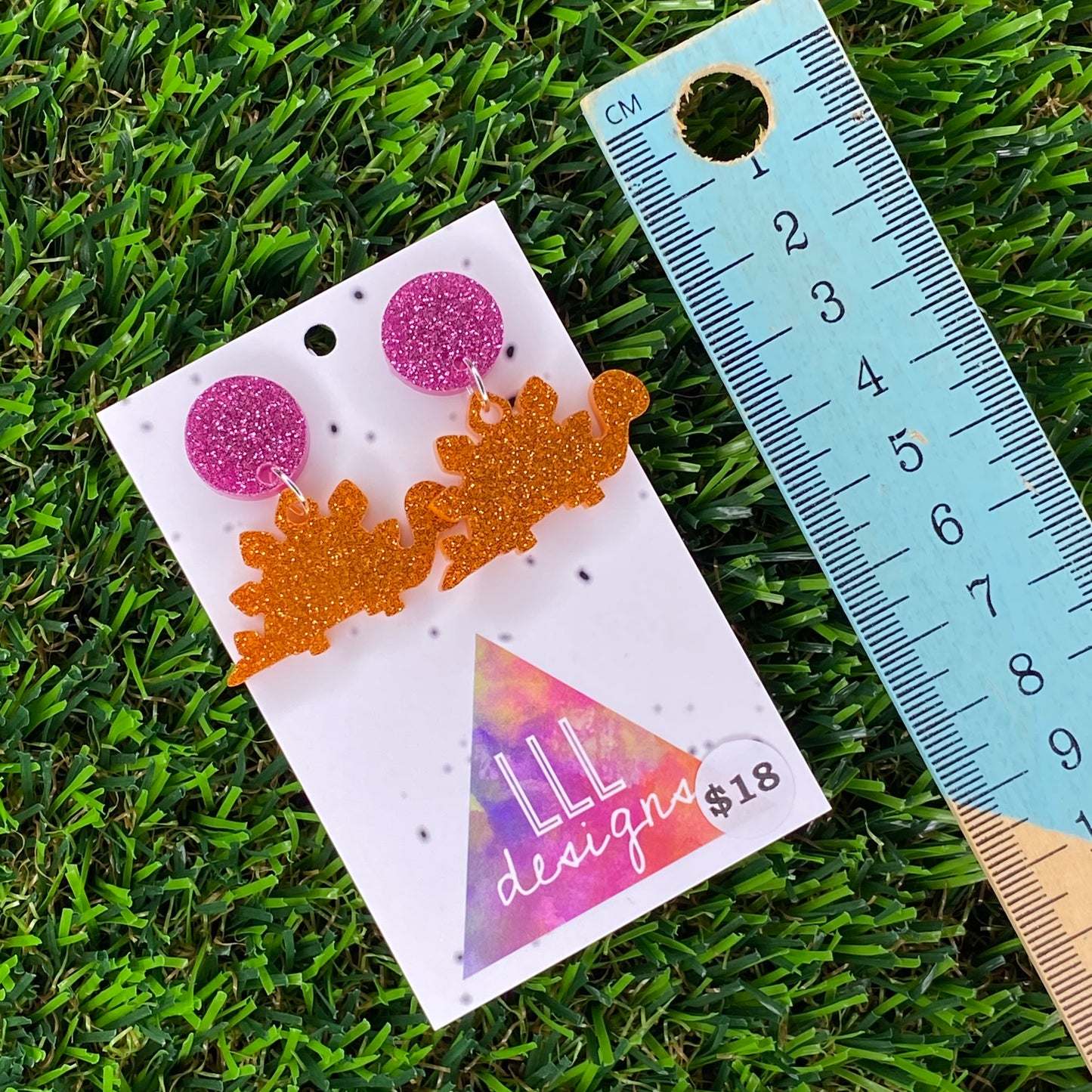 Stegosaurus Dinosaur Dangle Earrings in Glitter Orange Acrylic