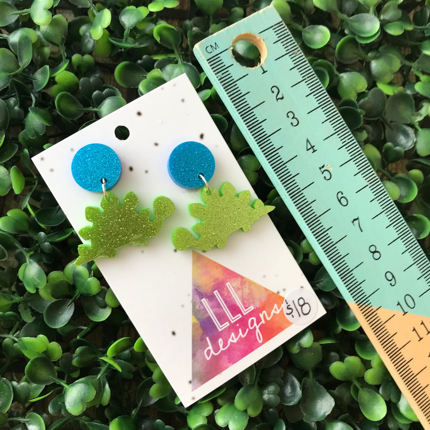 Stegosaurus Statement Dangle Earrings. Glitter Dino Dangles will always Brighten your day! Get your Groove on with this Glittery Guys!!