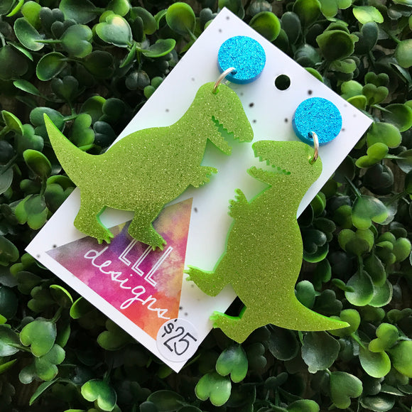 Terrific Trex Statement Dangle Earrings. Jumbo Dino Dangles will always Brighten your day! Get your Groove on with this Glittery Guys!!