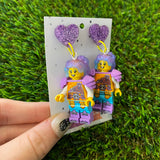 Battle Ready Lizzy Brick Character With Magical Hair and Super Cute Face Details Dangle Earrings - Featuring Purple Glitter Heart Shaped Tops!