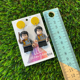 Uniformed Wizard Boy Brick Character with Wand Accessory Dangle Earrings - Featuring a Yellow Glitter Top!