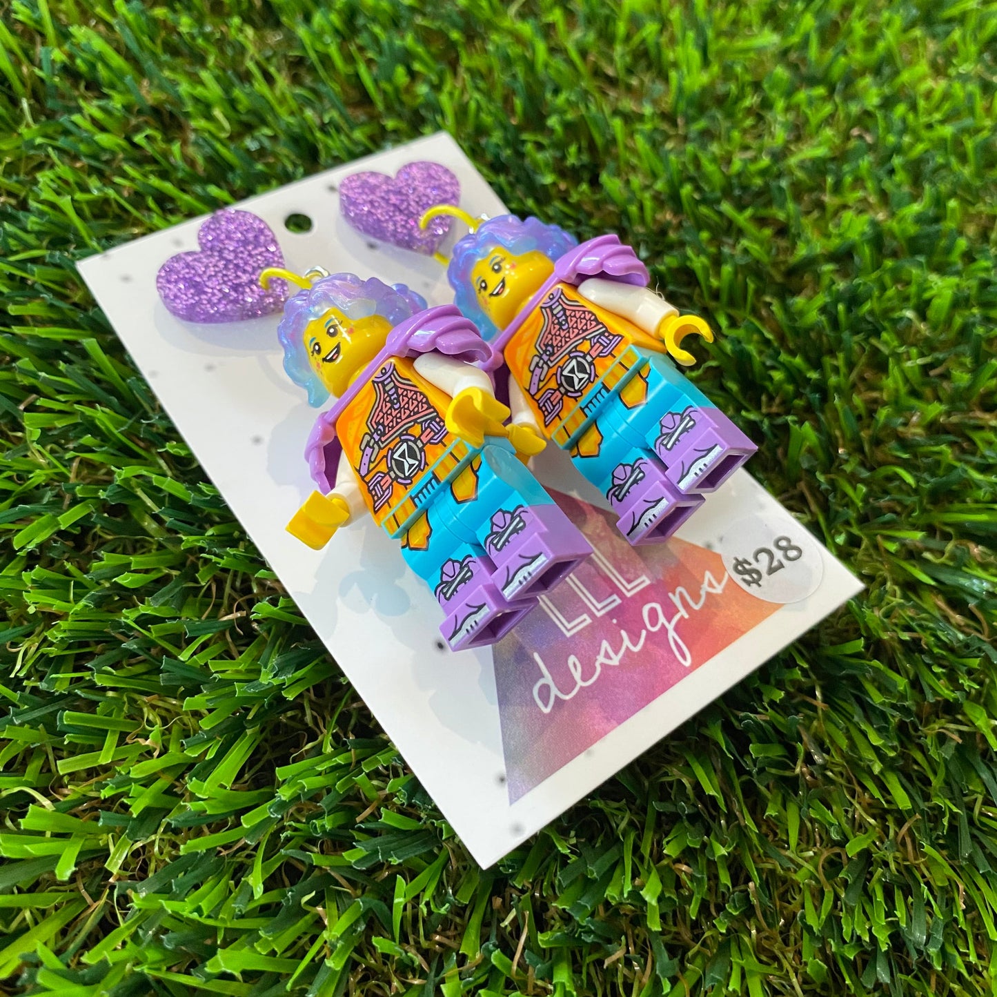 Battle Ready Lizzy Brick Character With Magical Hair and Super Cute Face Details Dangle Earrings - Featuring Purple Glitter Heart Shaped Tops!