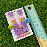 Pink Haired Cutie Brick Character With Purple Bunny Onesie Dangle Earrings With Plushies - Featuring Purple Glitter Heart Shaped Tops!