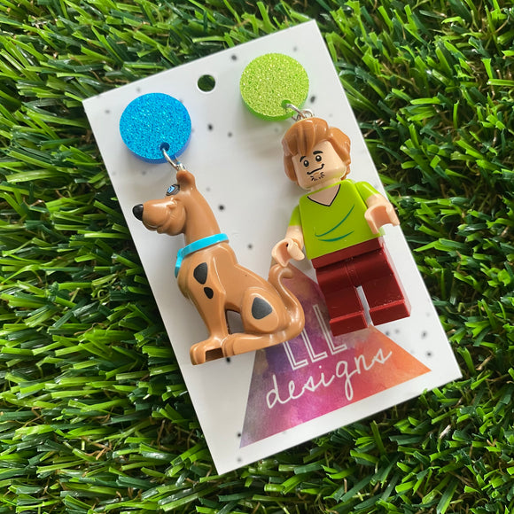 Mystery Duo Brick Character Dangle Earrings - Featuring Blue and Light Green Glittery Top!