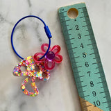 Resin Keyring / Bagtag - Dark Blue cable featuring Purple & Pink Daisy and Rainbow Confetti Mushroom! (12)