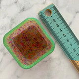 Resin Square Dish - Two Tone Rainbow Confetti featuring a Rainbow Confetti Base and Glitter Green Border! Brighten Up Your Life with this Bold and Fun Piece!