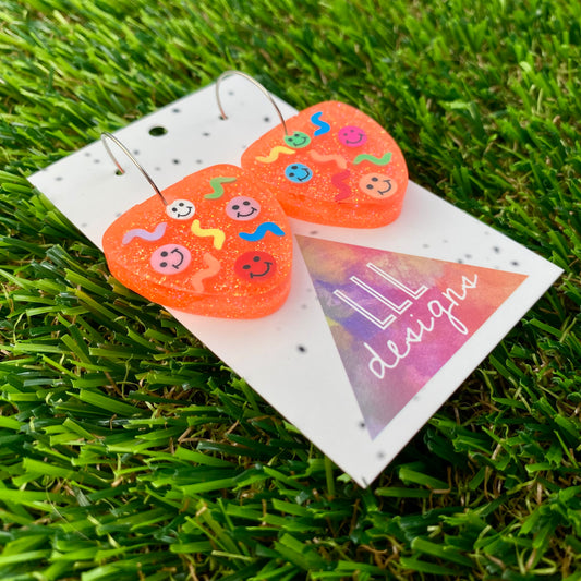 ON SALE!!! Resin Earrings - Glitter Neon Orange Guitar Pick Hoops Featuring Hand Placed Rainbow Smiley Faces and Squiggles!