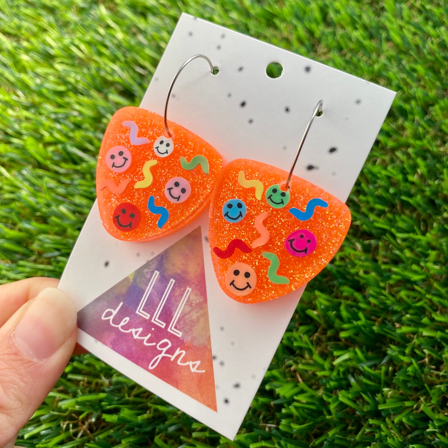 ON SALE!!! Resin Earrings - Glitter Neon Orange Guitar Pick Hoops Featuring Hand Placed Rainbow Smiley Faces and Squiggles!