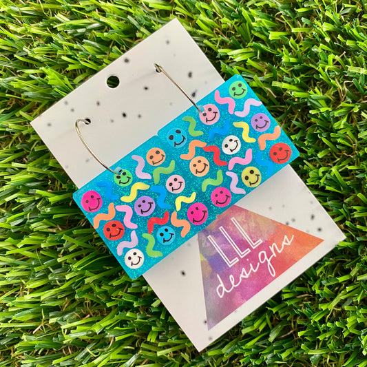 ON SALE!!!! Resin Earrings - Glitter Blue Square Hoops Featuring Hand Placed Rainbow Smiley Faces and Squiggles!
