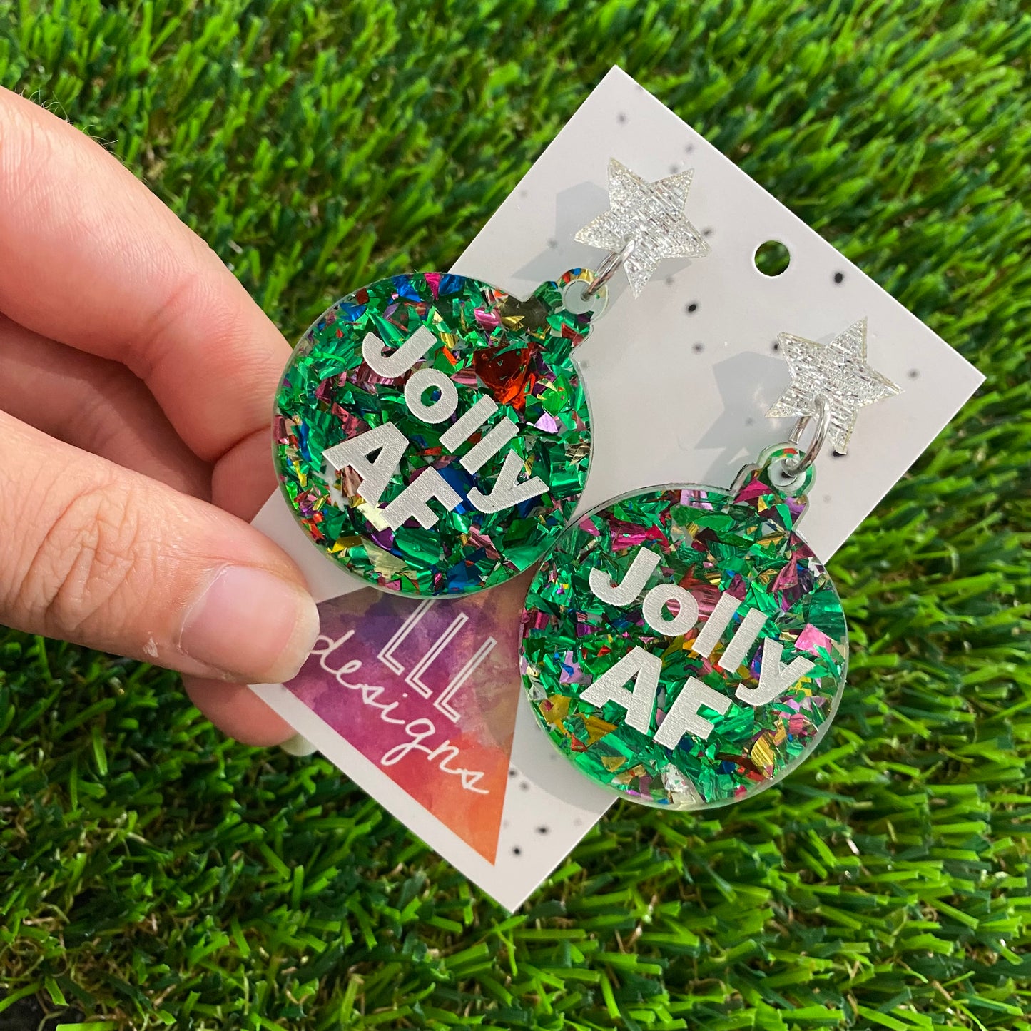 Jolly AF Statement Dangle Earrings in Green Tone and Rainbow Glitter Featuring Silver Star Tops.