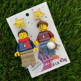 Christmas Couple Brick Earrings- Seasonal Couple with Ice Skates and Hot Chocolate Dangle Earrings, Featuring Festive Gold Star Tops.