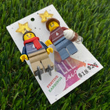 Christmas Couple Brick Earrings- Seasonal Couple with Ice Skates and Hot Chocolate Dangle Earrings, Featuring Festive Gold Star Tops.