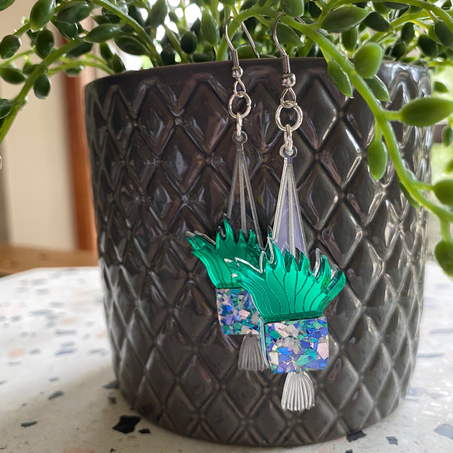 Hanging Planter Dangle Earrings. Featuring Stunning Blue and Silver Holographic Planters hanging from Surgical Stainless Steel Hooks.