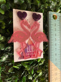 Flamingo Lover Duo Statement Dangle Statement Earrings. Featuring Purple Glitter Heart Tops.