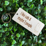 "I like cats & maybe 3 people" Quirky Timber Keyring - Laser Cut & Etched on Timber with Silvertone Hardware finished with a LLL Logo Tag.
