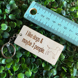 "I like dogs & maybe 3 people" Quirky Timber Keyring - Laser Cut & Etched on Timber with Silvertone Hardware finished with a LLL Logo Tag.