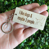 "I like dogs & maybe 3 people" Quirky Timber Keyring - Laser Cut & Etched on Timber with Silvertone Hardware finished with a LLL Logo Tag.