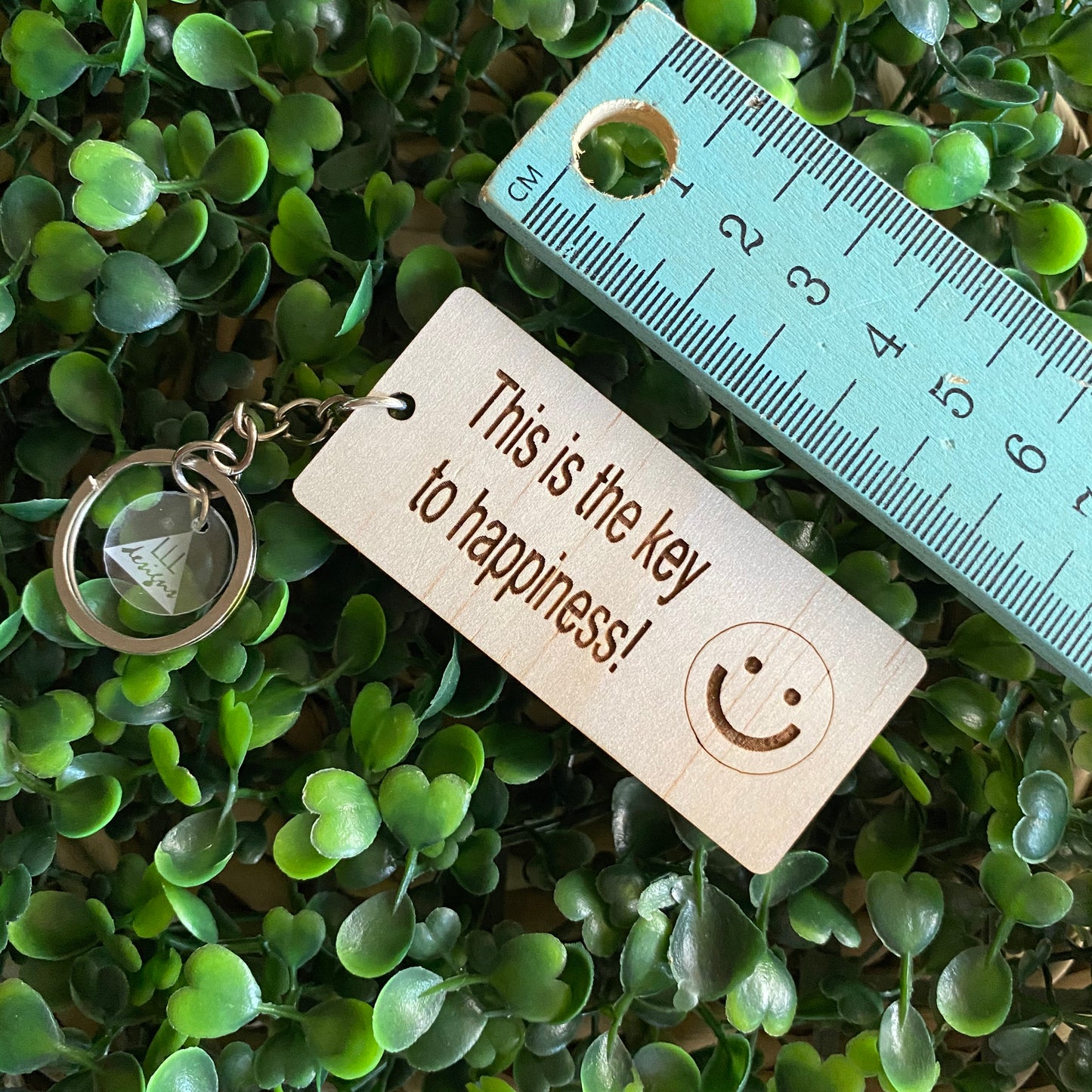 "This is the key to happiness! :)" Quirky Timber Keyring - Laser Cut & Etched on Timber with Silvertone Hardware finished with a LLL Logo Tag.