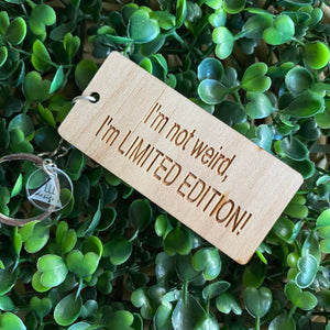 "I'm not weird, I'm LIMITED EDITION!" Quirky Timber Keyring - Laser Cut & Etched on Timber with Silvertone Hardware finished with a LLL Logo Tag.