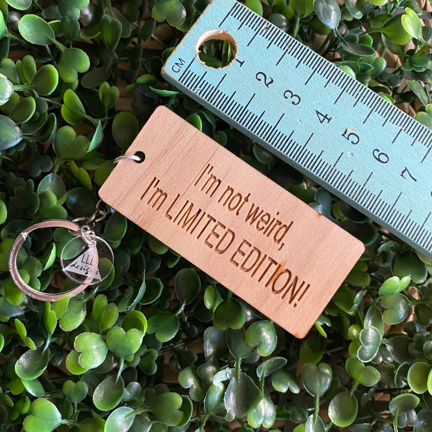 "I'm not weird, I'm LIMITED EDITION!" Quirky Timber Keyring - Laser Cut & Etched on Timber with Silvertone Hardware finished with a LLL Logo Tag.