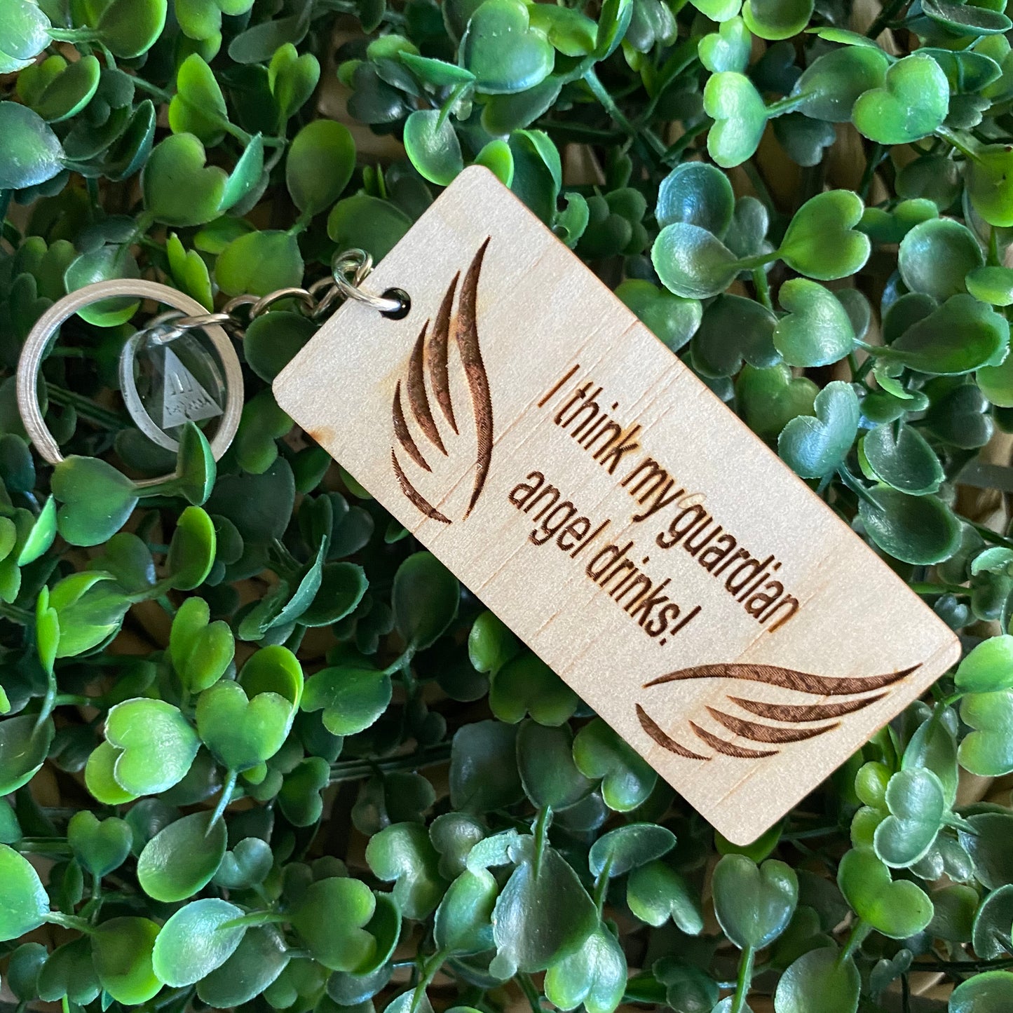 "I think my guardian angel drinks!" Quirky Timber Keyring - Laser Cut & Etched on Timber with Silvertone Hardware finished with a LLL Logo Tag.