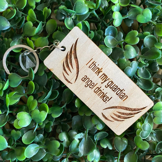 "I think my guardian angel drinks!" Quirky Timber Keyring - Laser Cut & Etched on Timber with Silvertone Hardware finished with a LLL Logo Tag.