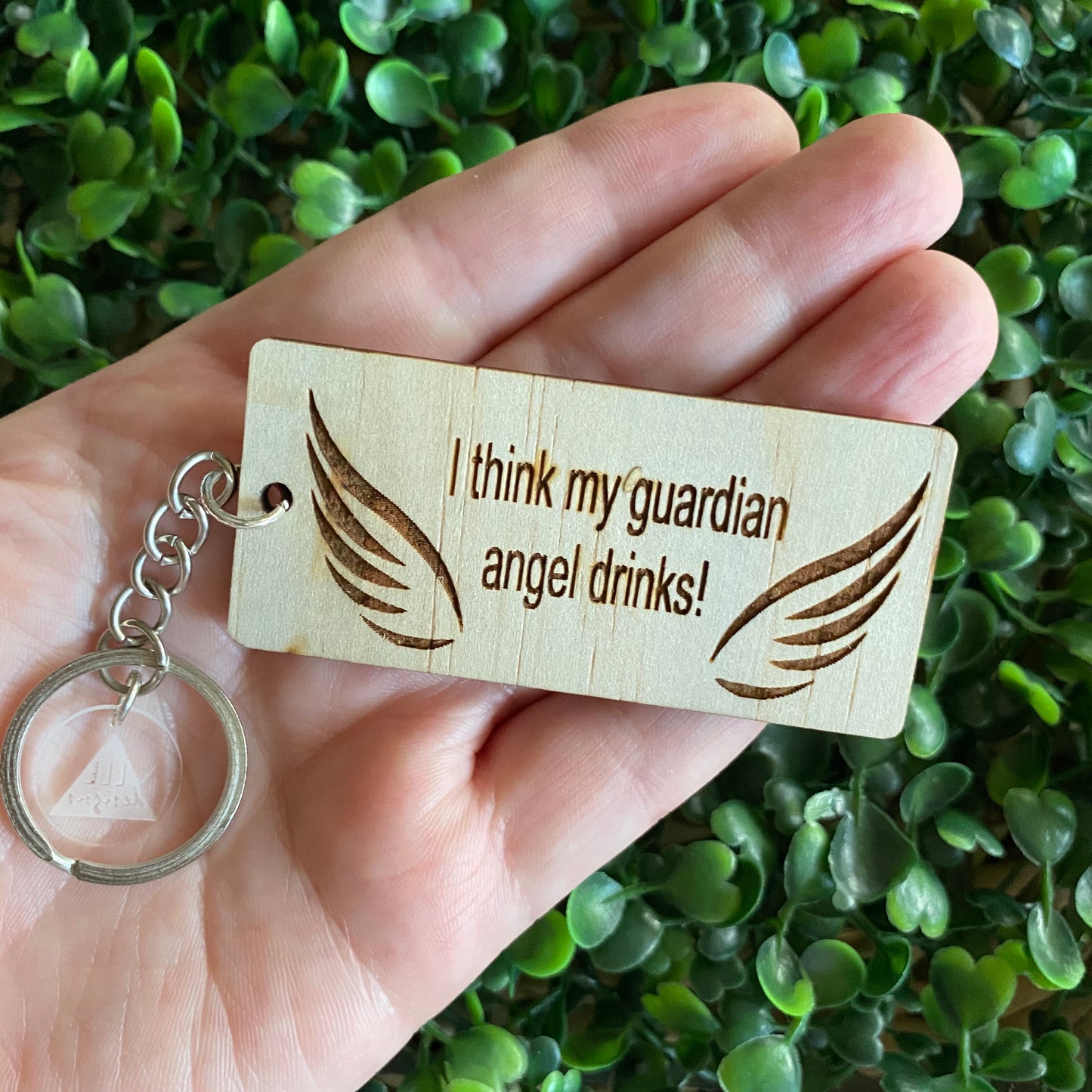 "I think my guardian angel drinks!" Quirky Timber Keyring - Laser Cut & Etched on Timber with Silvertone Hardware finished with a LLL Logo Tag.