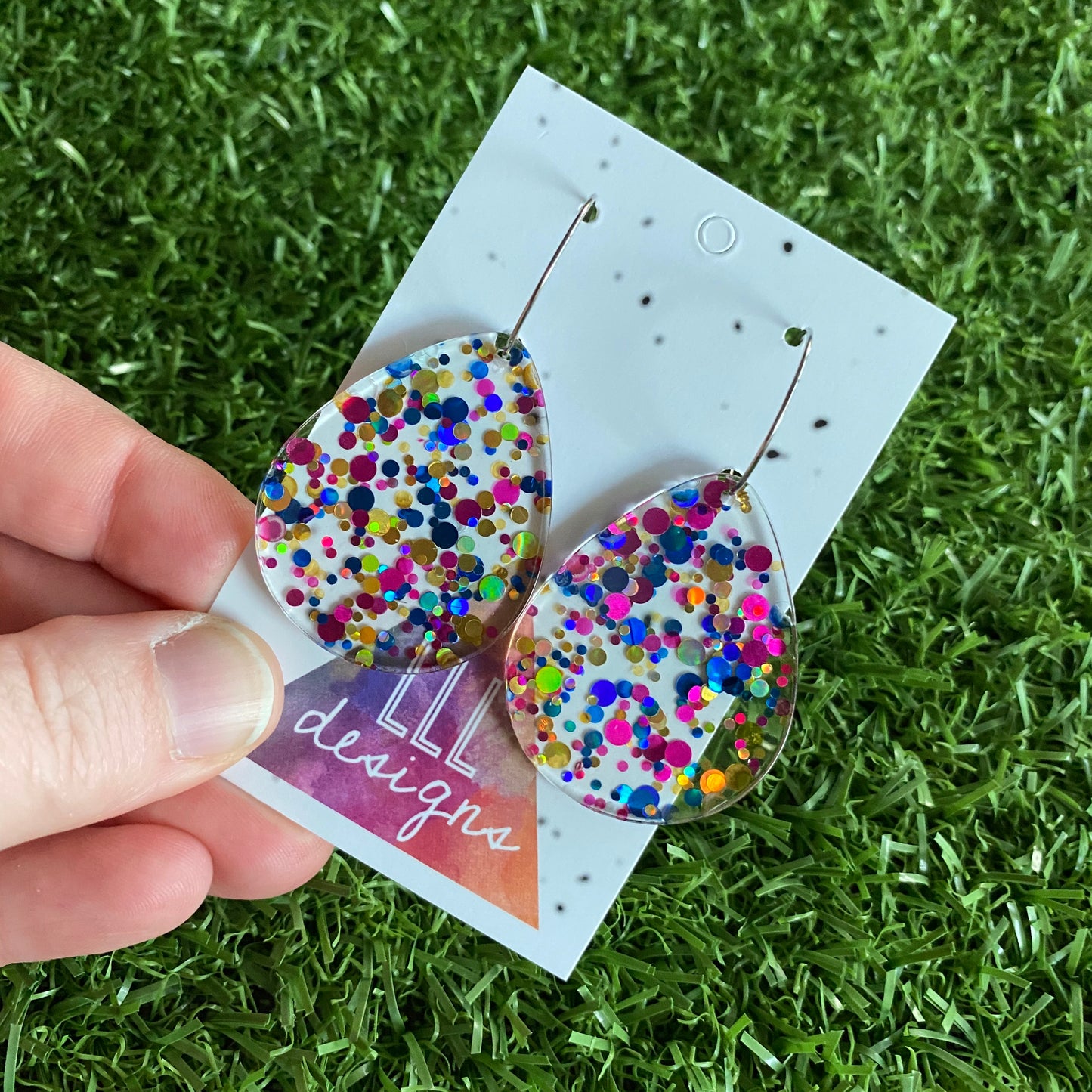 Stunning Clear Tear Drops featuring Polka Dot Confetti Scattered Throughout. Creating a beautiful visual effect. (Blue/Pink/Gold).