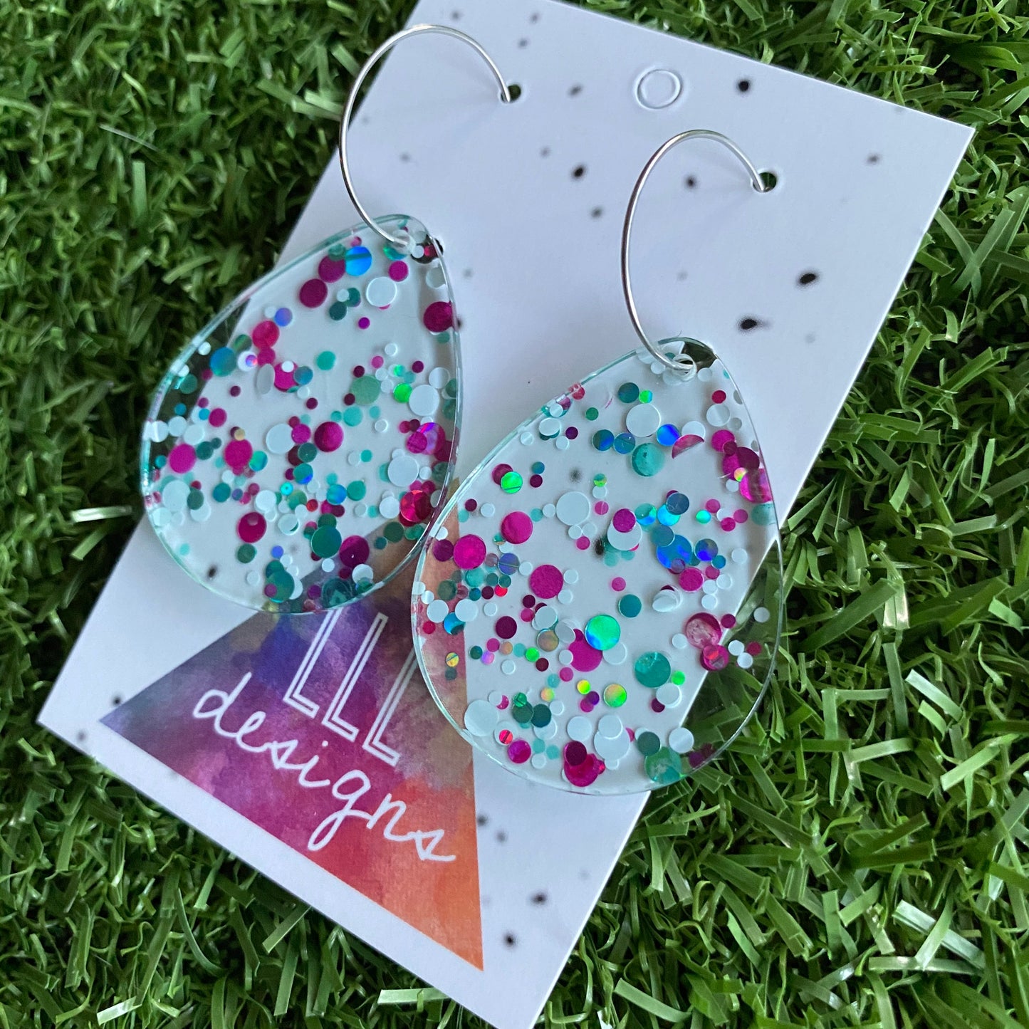 Stunning Clear Tear Drops featuring Polka Dot Confetti Scattered Throughout. Creating a beautiful visual effect. (White/Pink/Aqua).