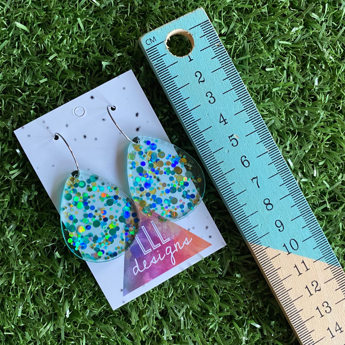 Stunning Clear Tear Drops featuring Polka Dot Confetti Scattered Throughout. Creating a beautiful visual effect. (Gold/Blue/Aqua).