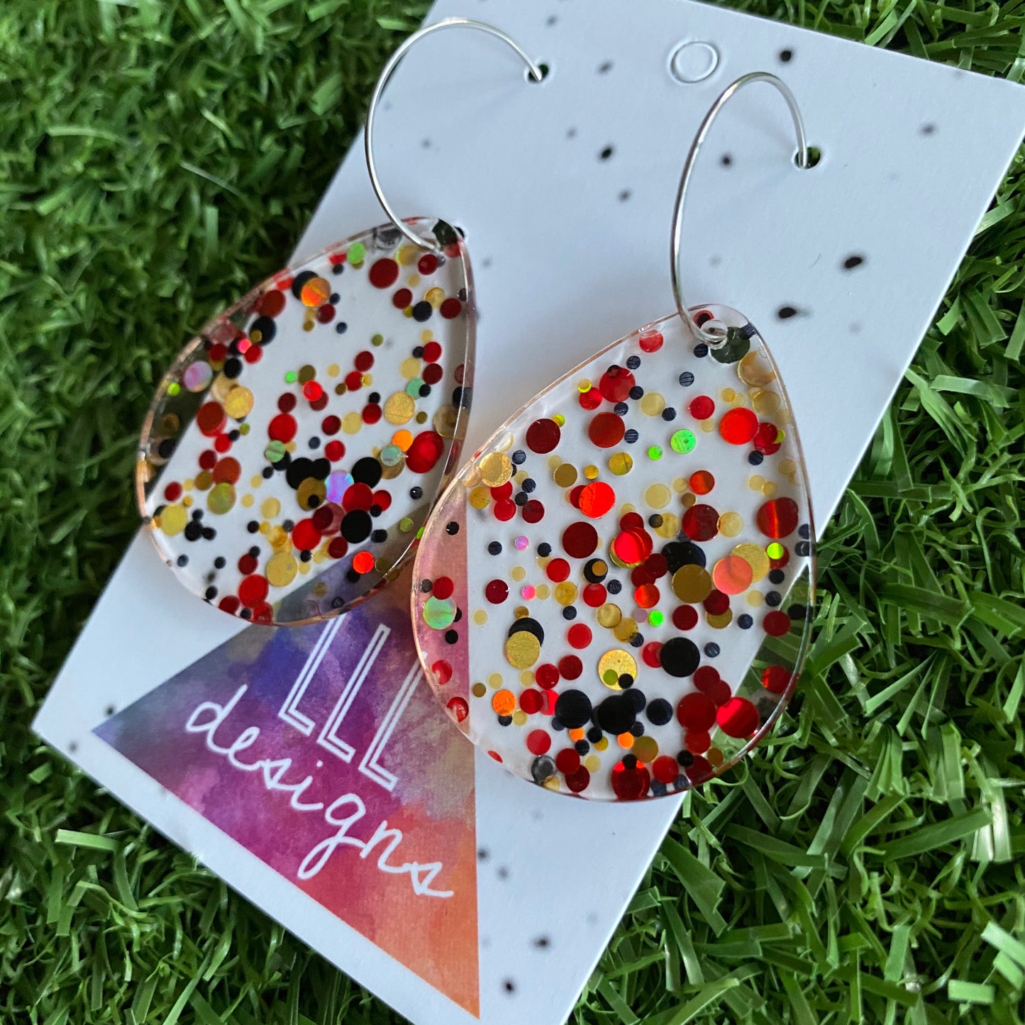 Stunning Clear Tear Drops featuring Polka Dot Confetti Scattered Throughout. Creating a beautiful visual effect. (Gold/Red/Black).