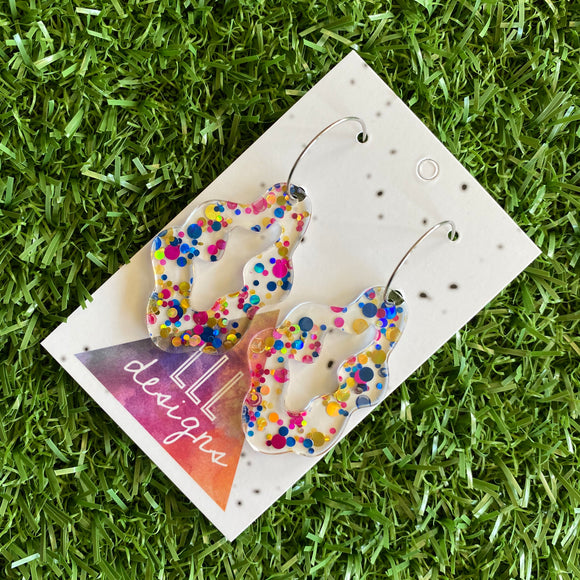 Stunning Clear Wiggle Jiggle Drops featuring Polka Dot Confetti Scattered Throughout. Creating a beautiful visual effect. (Gold/Pink/Blue).