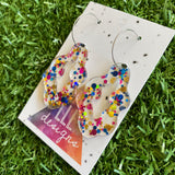 Stunning Clear Wiggle Jiggle Drops featuring Polka Dot Confetti Scattered Throughout. Creating a beautiful visual effect. (Gold/Pink/Blue).