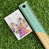 Stunning Clear Wiggle Jiggle Drops featuring Polka Dot Confetti Scattered Throughout. Creating a beautiful visual effect. (Gold/Pink/Blue).