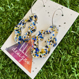 Stunning Clear Wiggle Jiggle Drops featuring Polka Dot Confetti Scattered Throughout. Creating a beautiful visual effect. (Gold/Black/Blue).