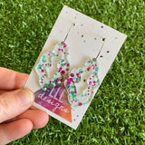 Stunning Clear Wiggle Jiggle Drops featuring Polka Dot Confetti Scattered Throughout. Creating a beautiful visual effect. (White/Aqua/Pink).