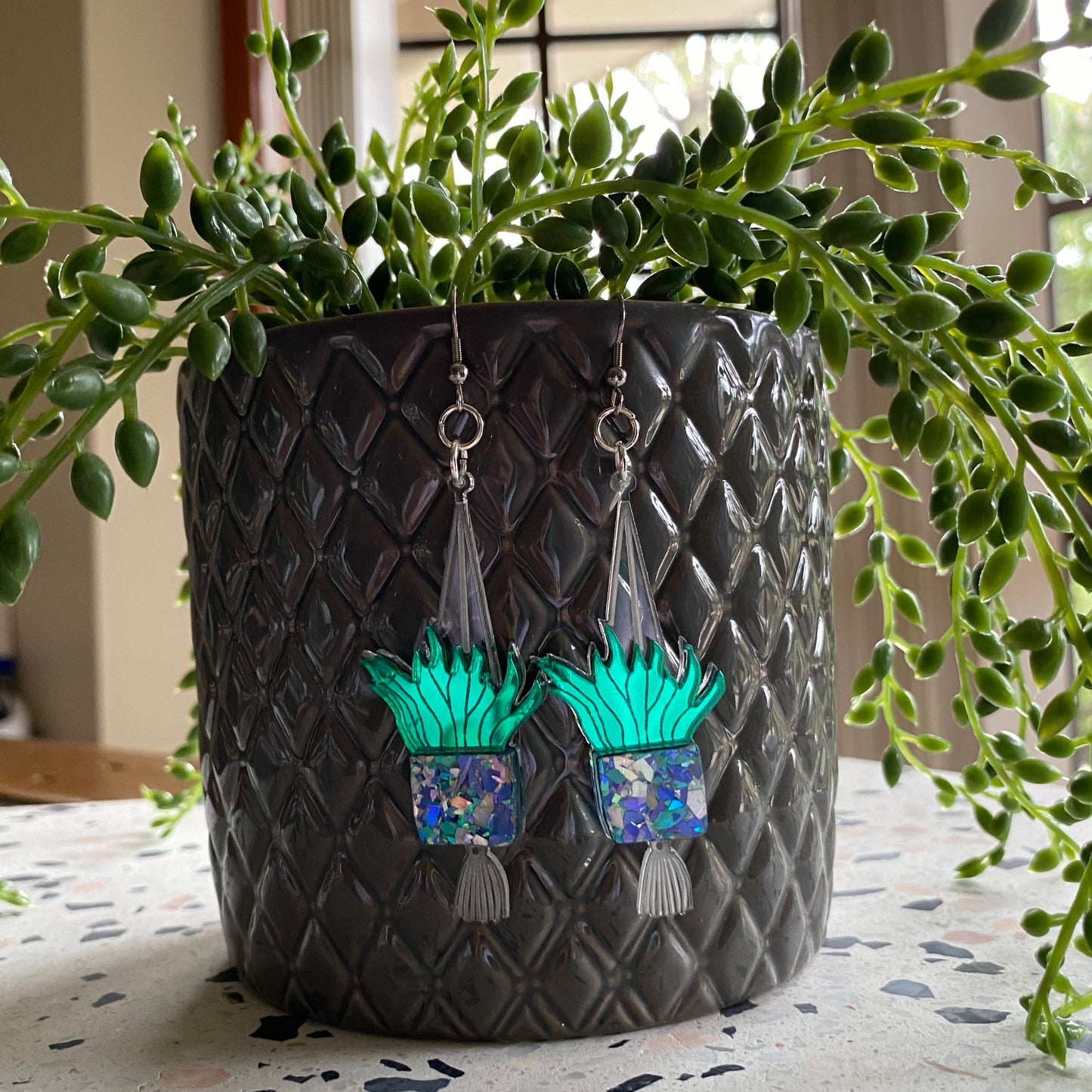 Hanging Planter Dangle Earrings. Featuring Stunning Blue and Silver Holographic Planters hanging from Surgical Stainless Steel Hooks.